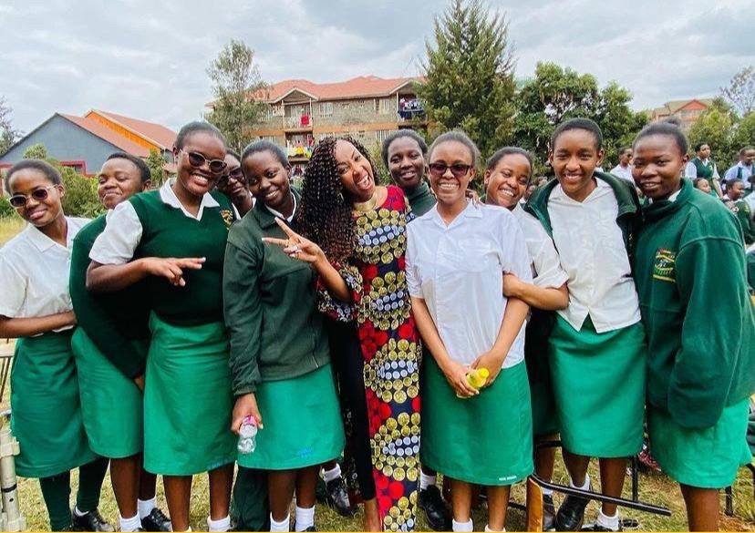 Mwalimu Rachel surrounded by students at a mentorship visit